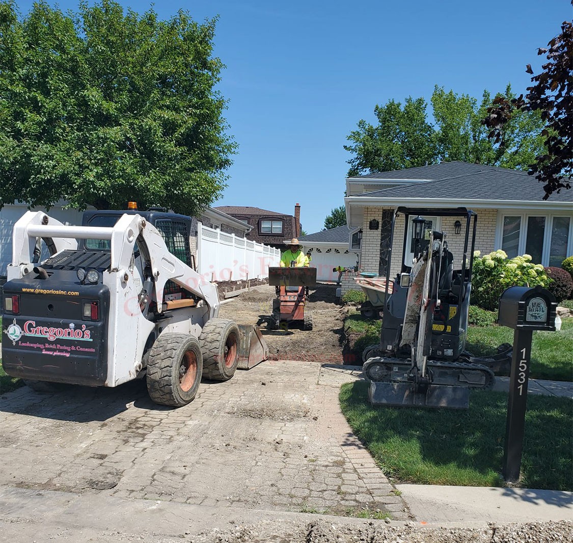 Gregorio's team working on a driveway