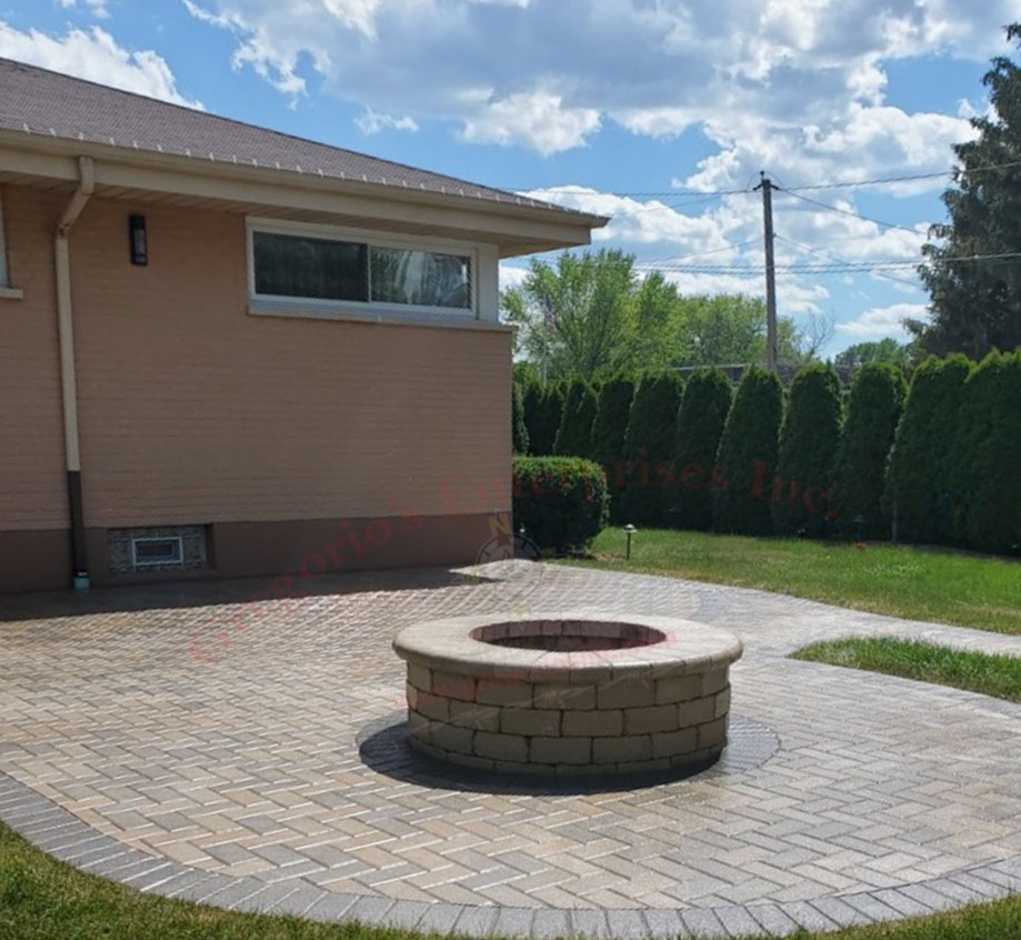 Brick paving patio and a brick paving firepit in the middle