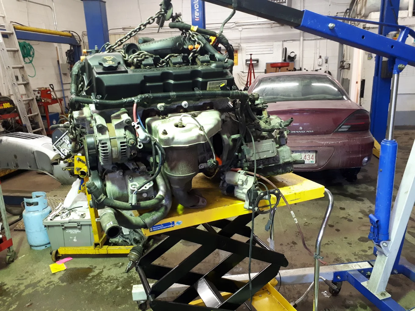 Engine removed for repair on an engine stand at JCo Auto