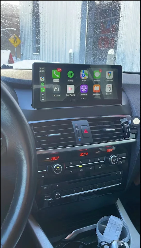 Widescreen CarPlay display installed in a car dashboard