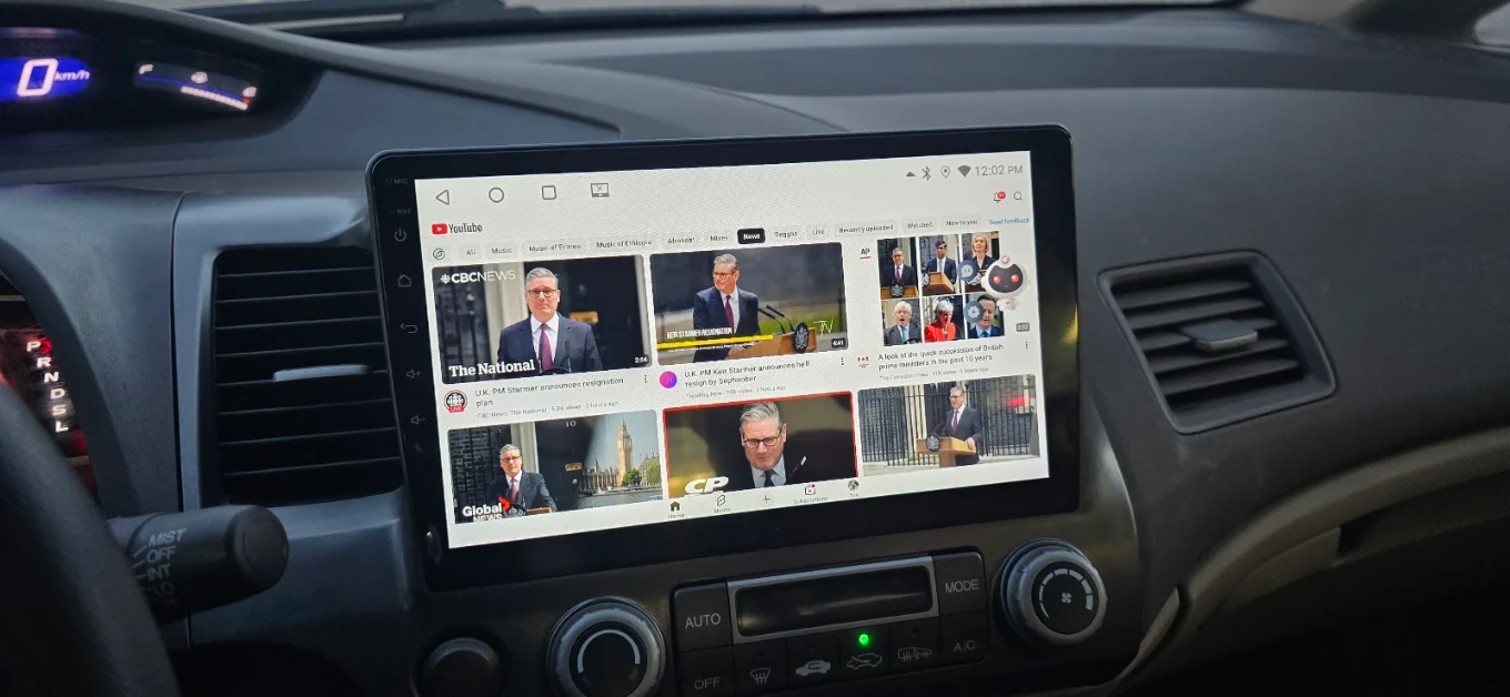 Large touchscreen head unit installed in a sedan dashboard