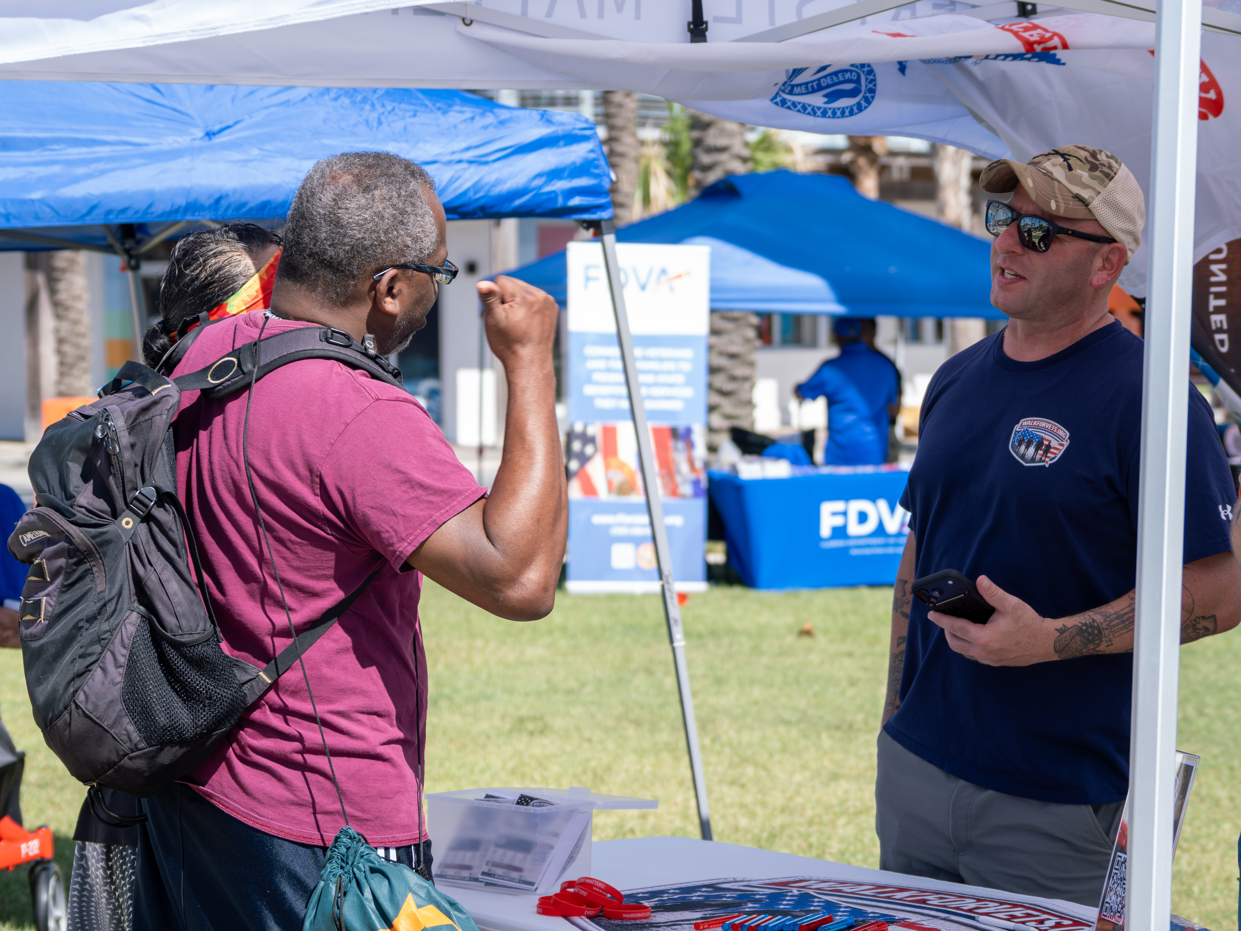 John Ring of WalkforVets.org speaks with Navy Veteran at Freeman Douglas' Veteran Legacy Community Festival John Ring of WalkforVets.org speaks with Navy Veteran at Freeman Douglas' Veteran Legacy Community Festival