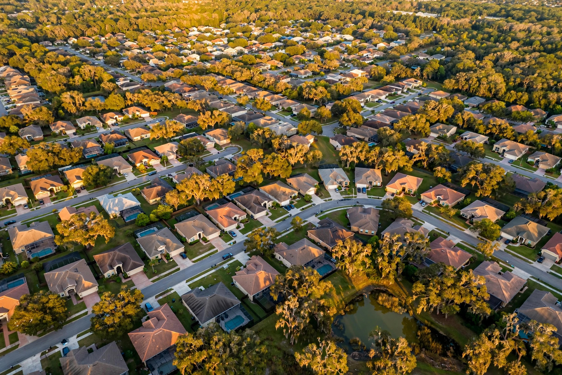 Aerial view of a suburban Jacksonville Florida neighborhood at golden hour — a cooling market where VA appraisal gaps are becoming more common