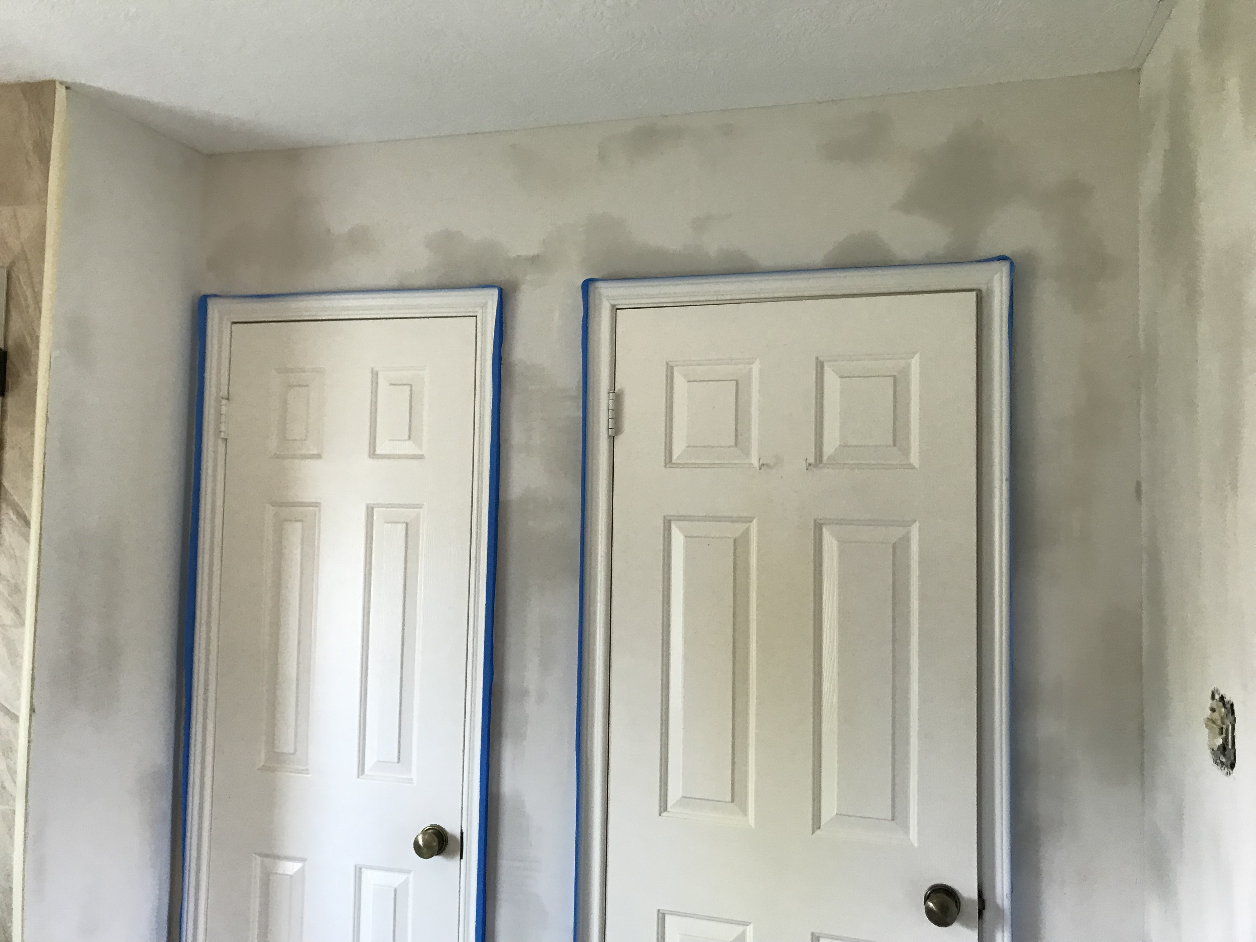 Smoothly sanded drywall repair with seamless joint compound in a Cypress, TX home interior.