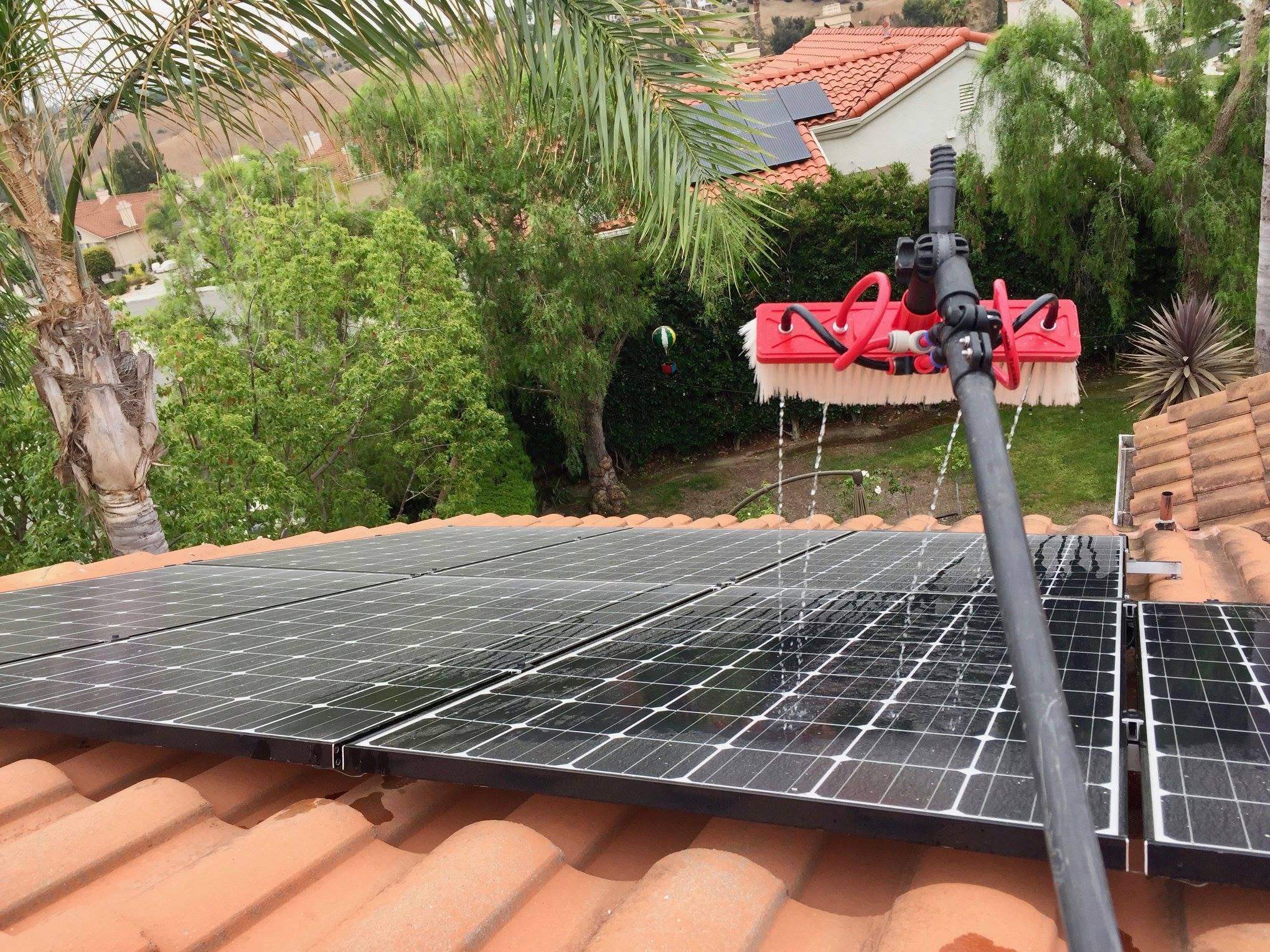 Solar panel cleaning equipment in use