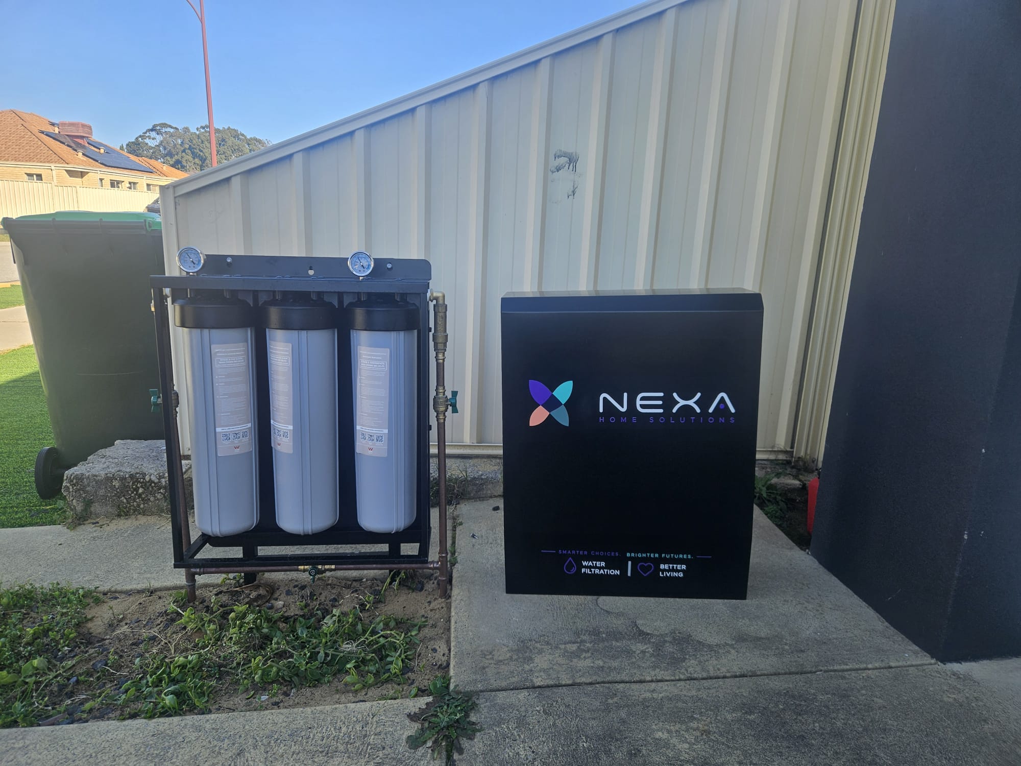 Nexa Select cabinet shown beside its three filtration housings
