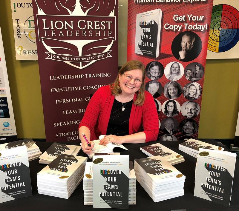 Kathy signing copies of her book