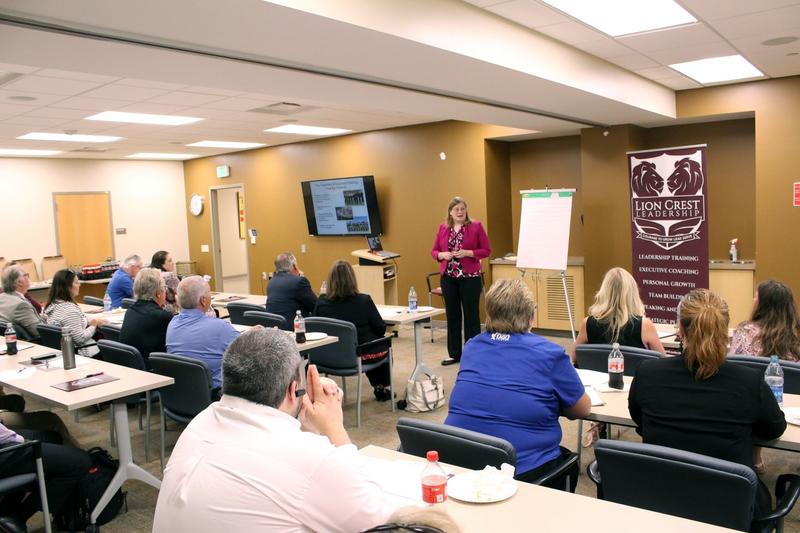 Kathy leading a leadership workshop for a full room