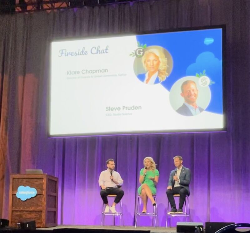 Klare Chapman speaking on stage at a technology conference