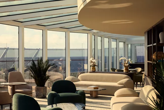 Spacious luxury cruise residential suite with private ocean-view terrace