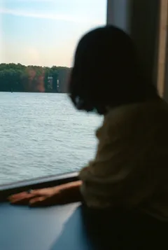 Guest enjoying river views aboard a cruise ship