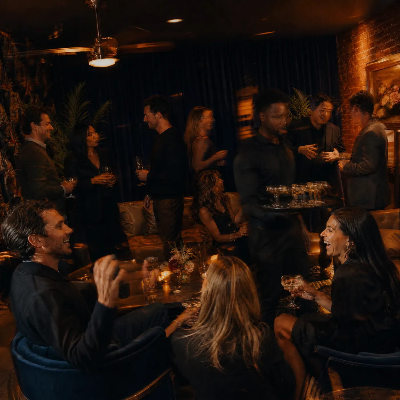 Coworkers with cocktails in the lounge