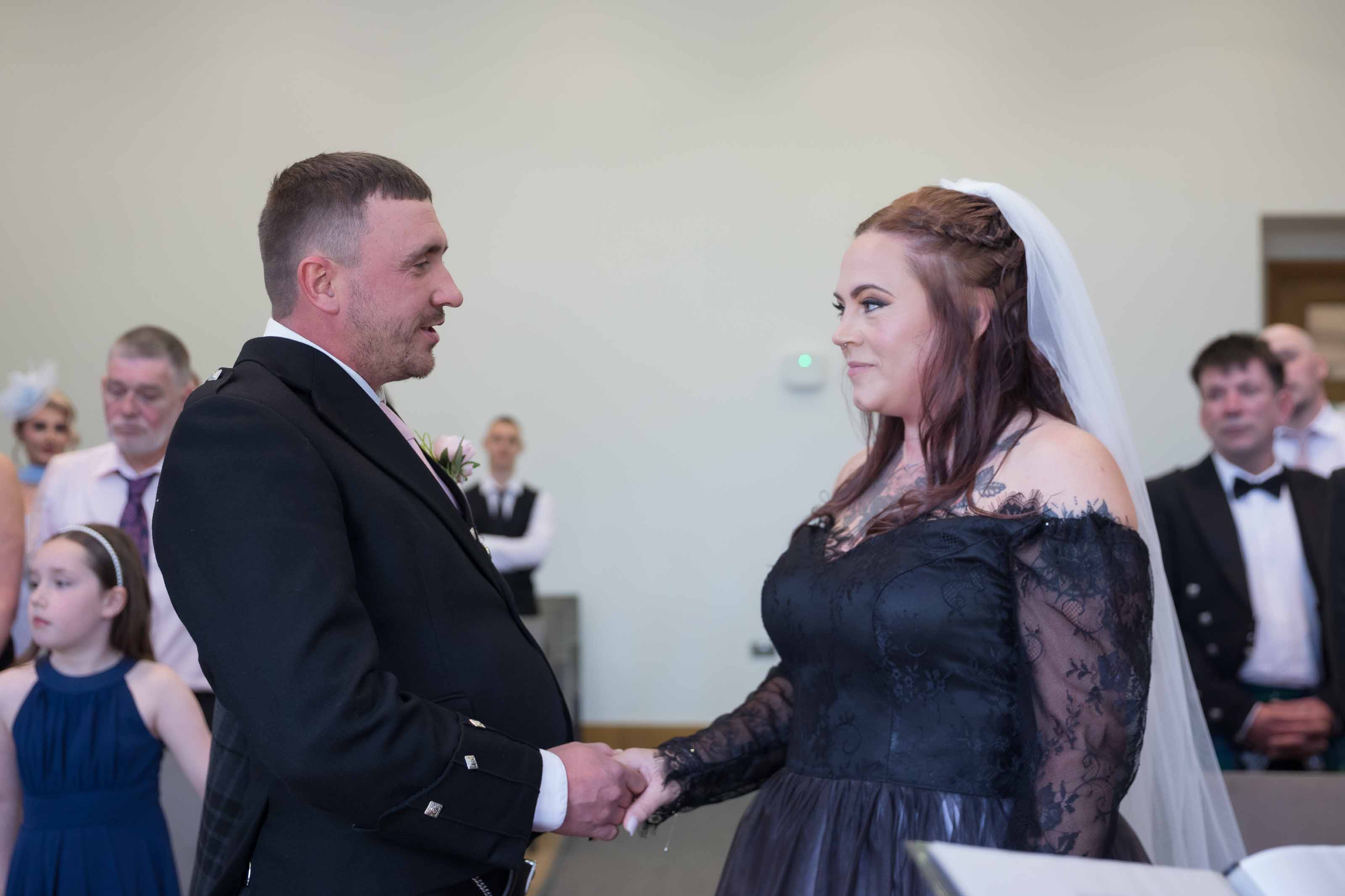 Bride and groom during wedding ceremony at The Burns Monument, Kilmarnock, Ayrshire
