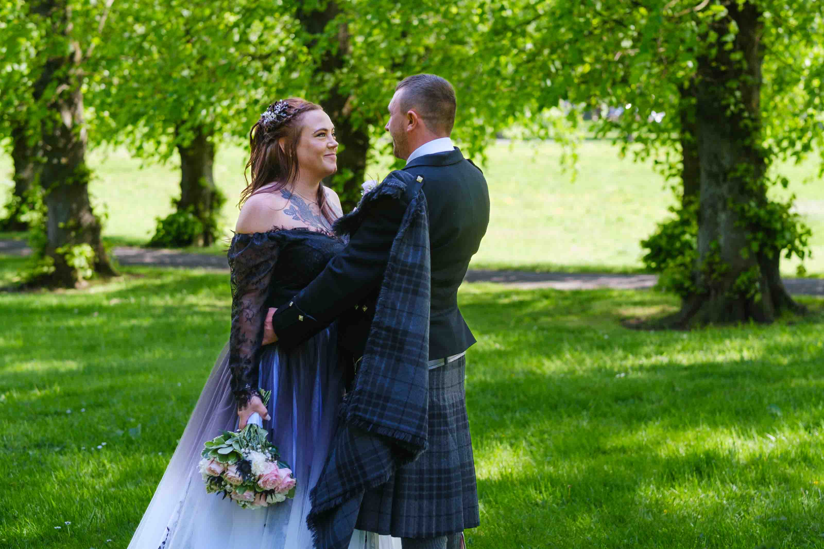 Newly married couple in the ground around The Burns Monument, Kay Park, Kilmarnock