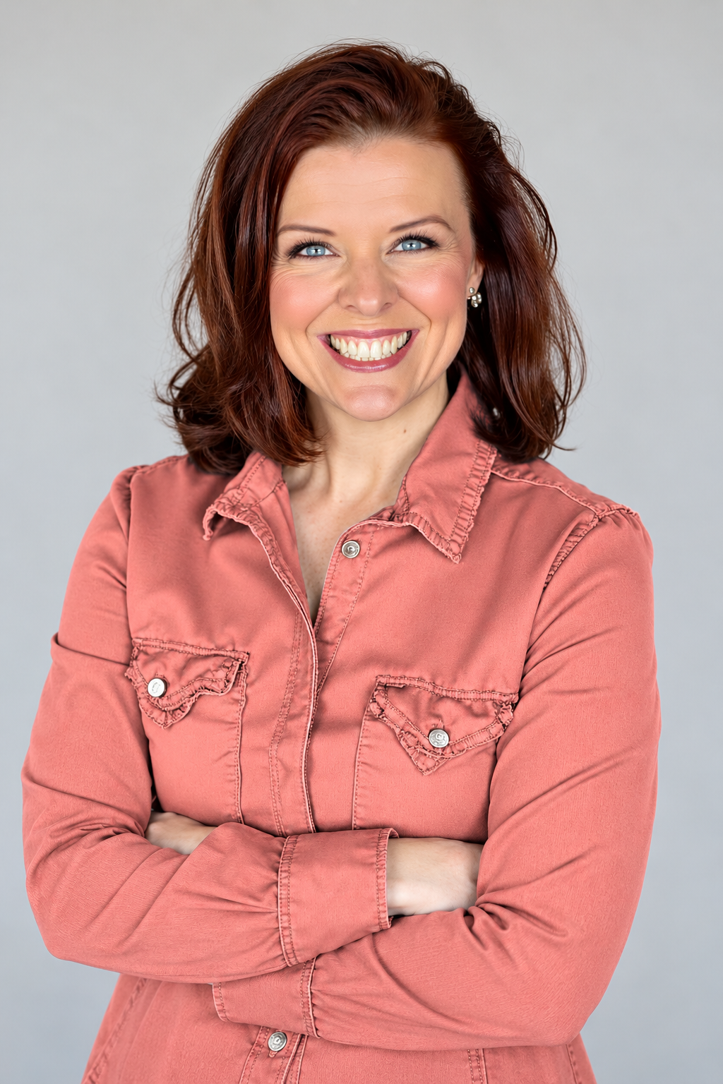 Jen Springer, founder of Your Dream Client Studio, smiling with arms crossed