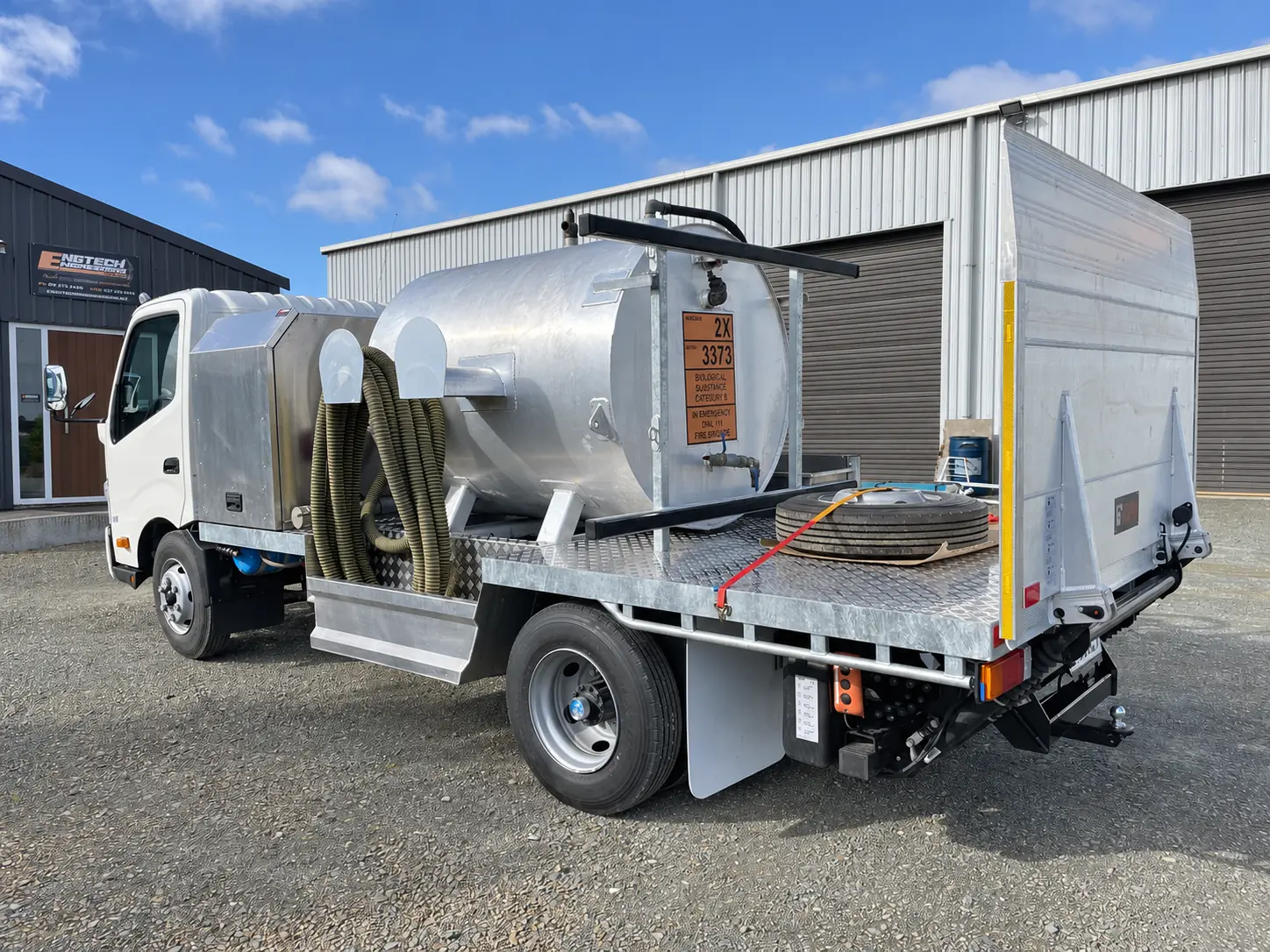 Truck body with side storage compartments
