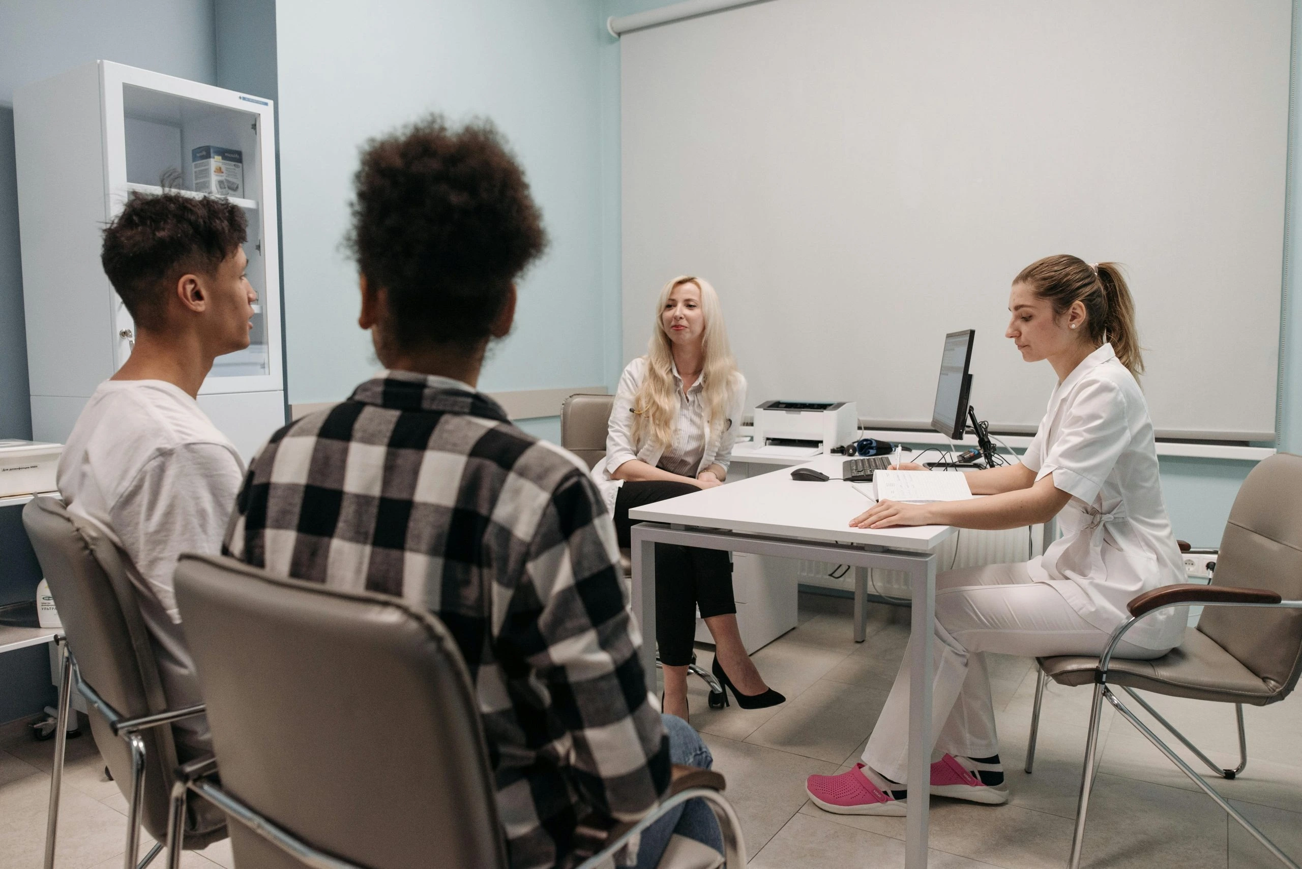 Healthcare practitioner reviewing an injury care treatment plan