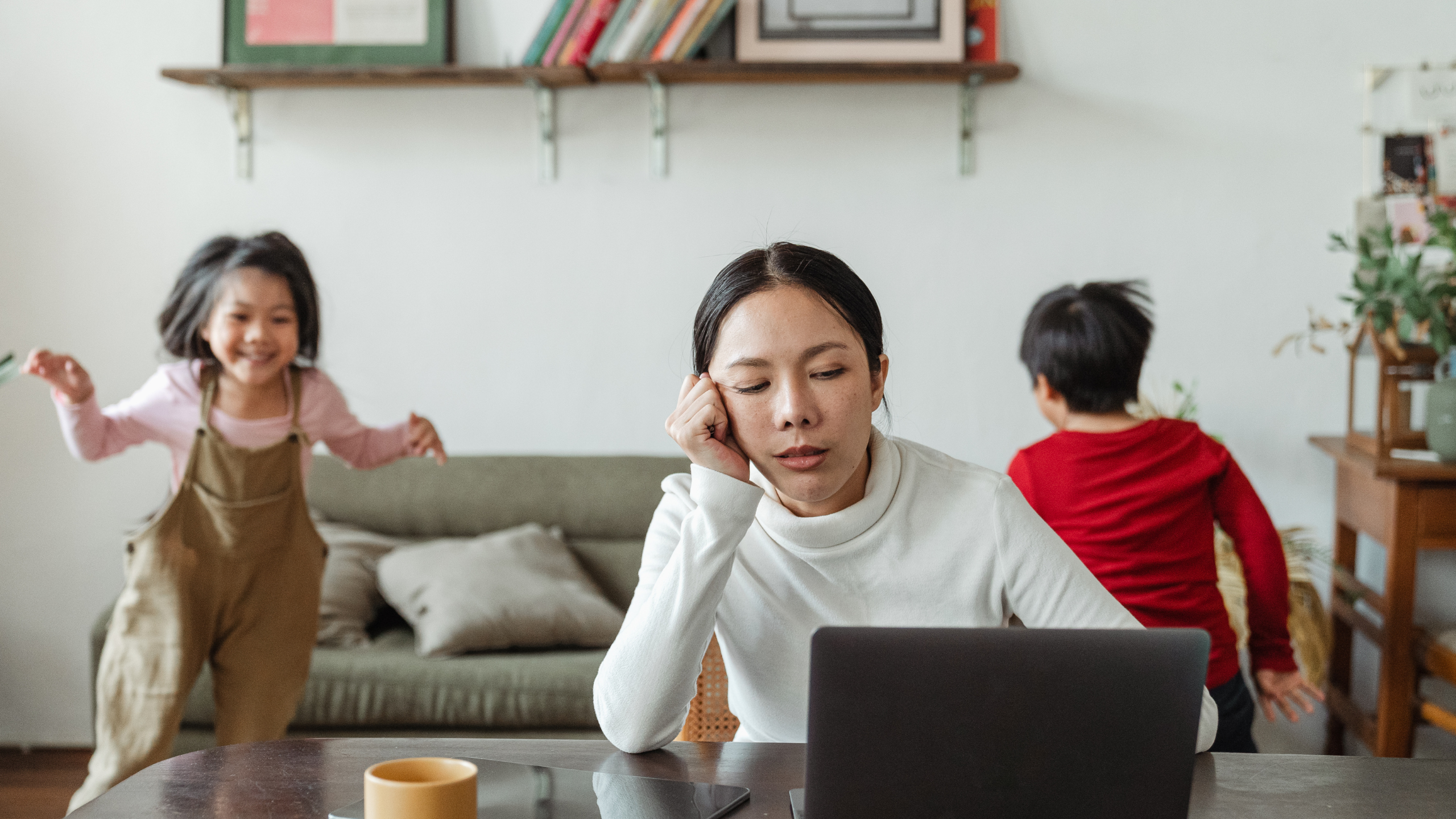 Busy mother working from home while balancing family life