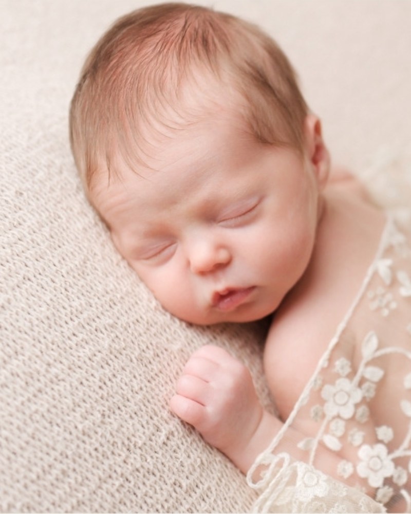 Sleeping newborn with lace