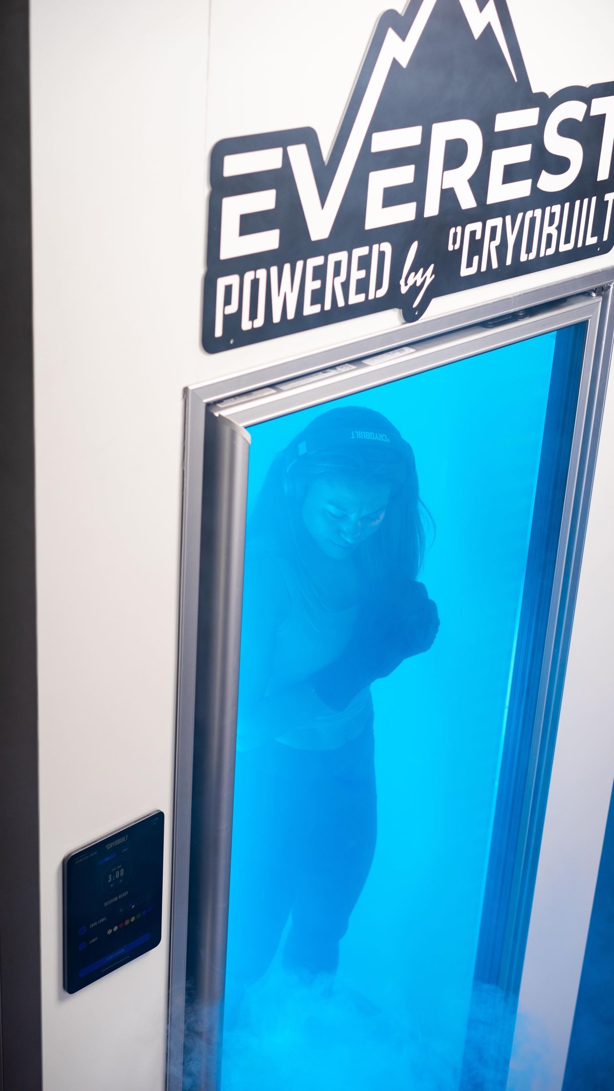 Client inside the Everest whole body cryotherapy chamber at Restart