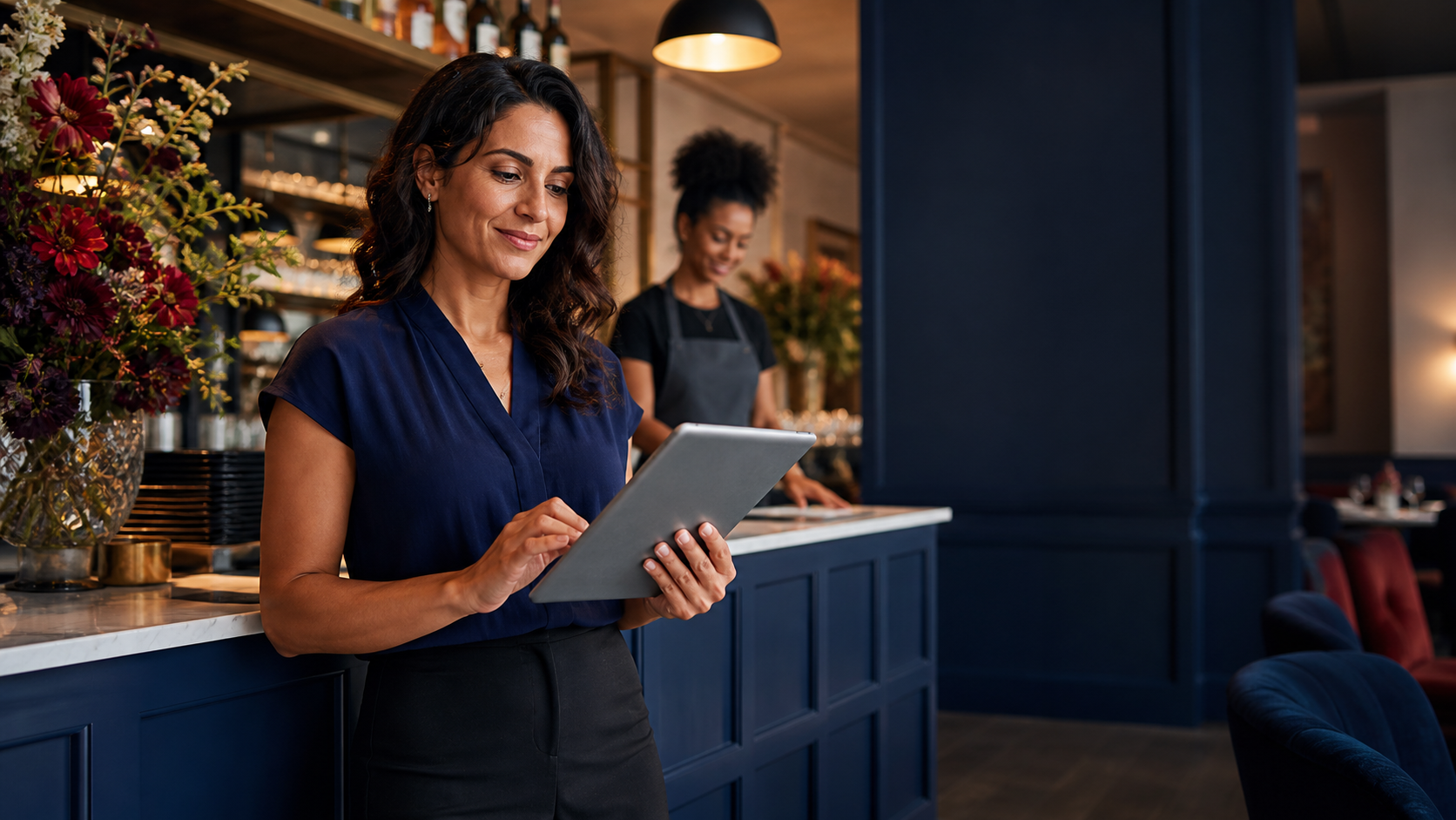 Restaurant owner reviewing business funding opportunities on a tablet