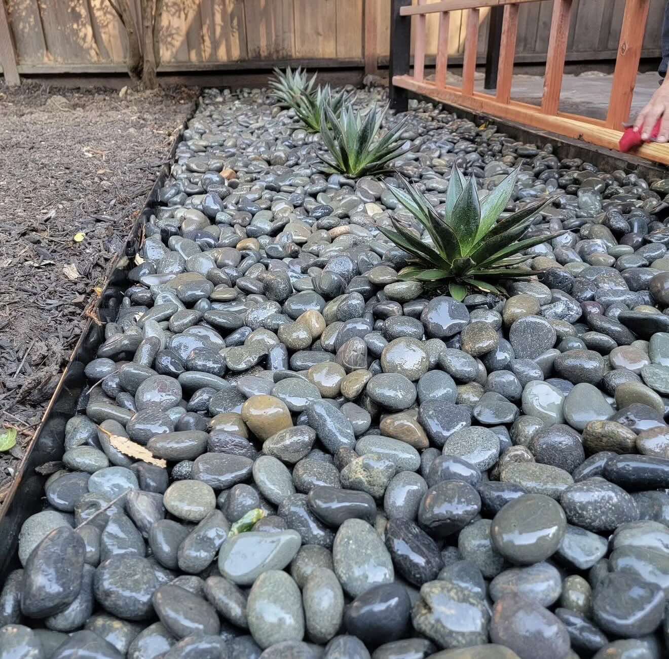 Custom stonework and hardscaping project for a Sonoma County property, built by RE Landscape Sonoma using river rocks