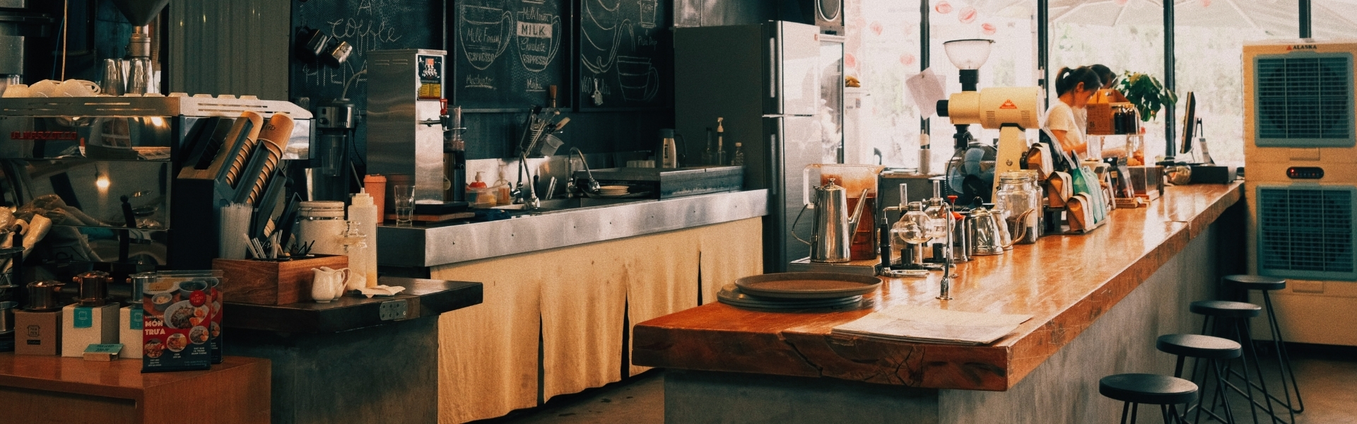 A latte and a croissant on a café table