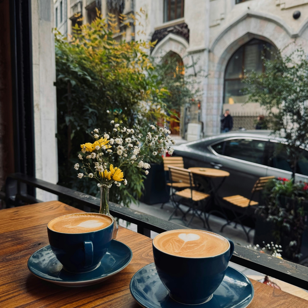 Roasted Ethiopian coffee beans with a white cup