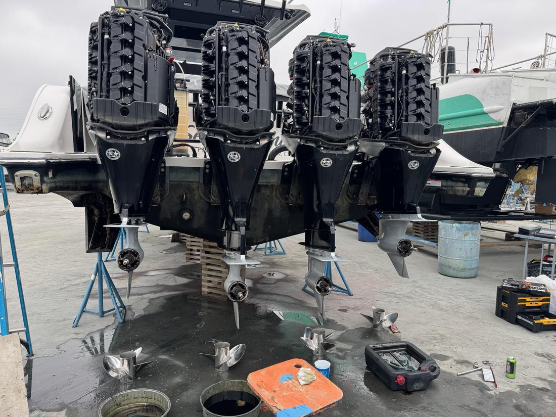 Quad Mercury 400 outboard engines serviced on a center console boat