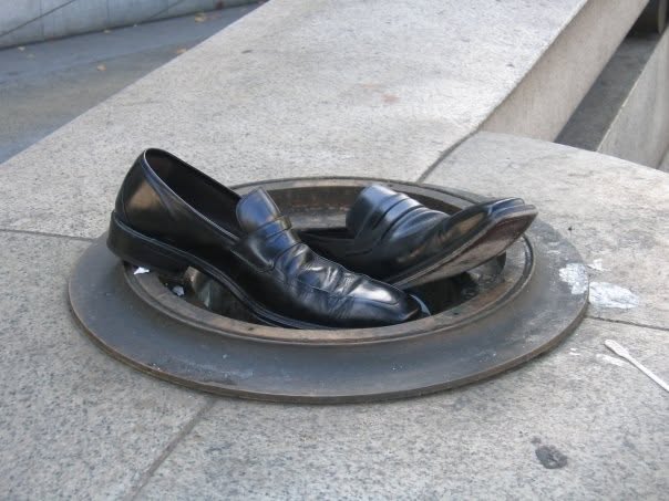 Shoes being discarded and replaced - a metaphor for stepping into a role more congruent with who you are now