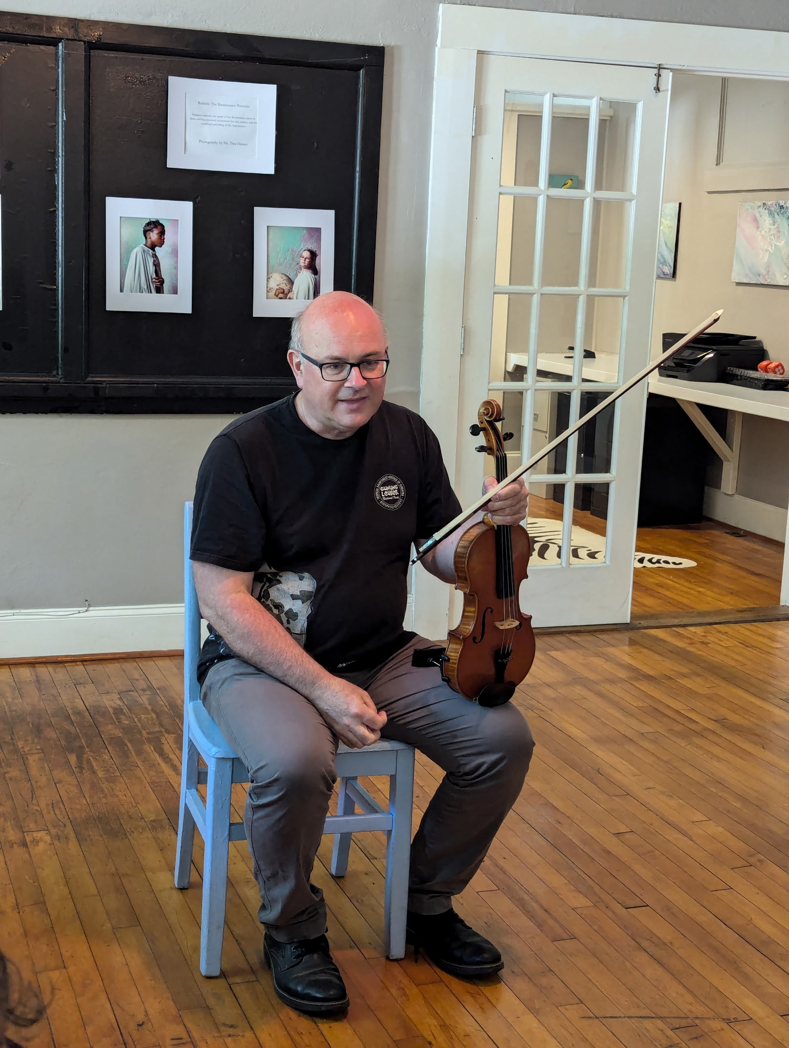 Colin teaching fiddle at a school in Durham