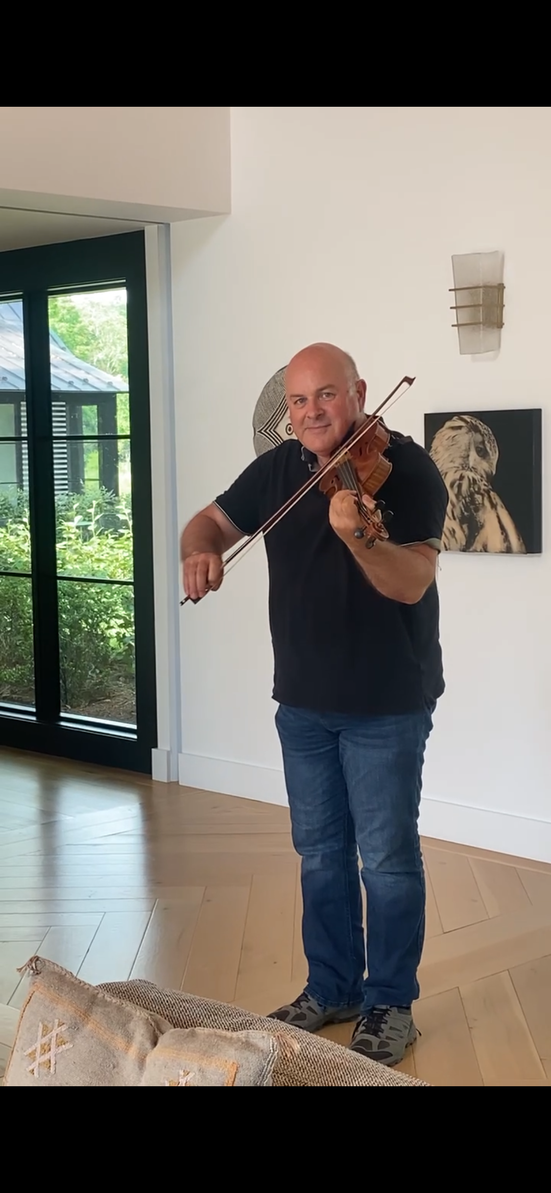 Colin playing fiddle at a winery near Charlottesville