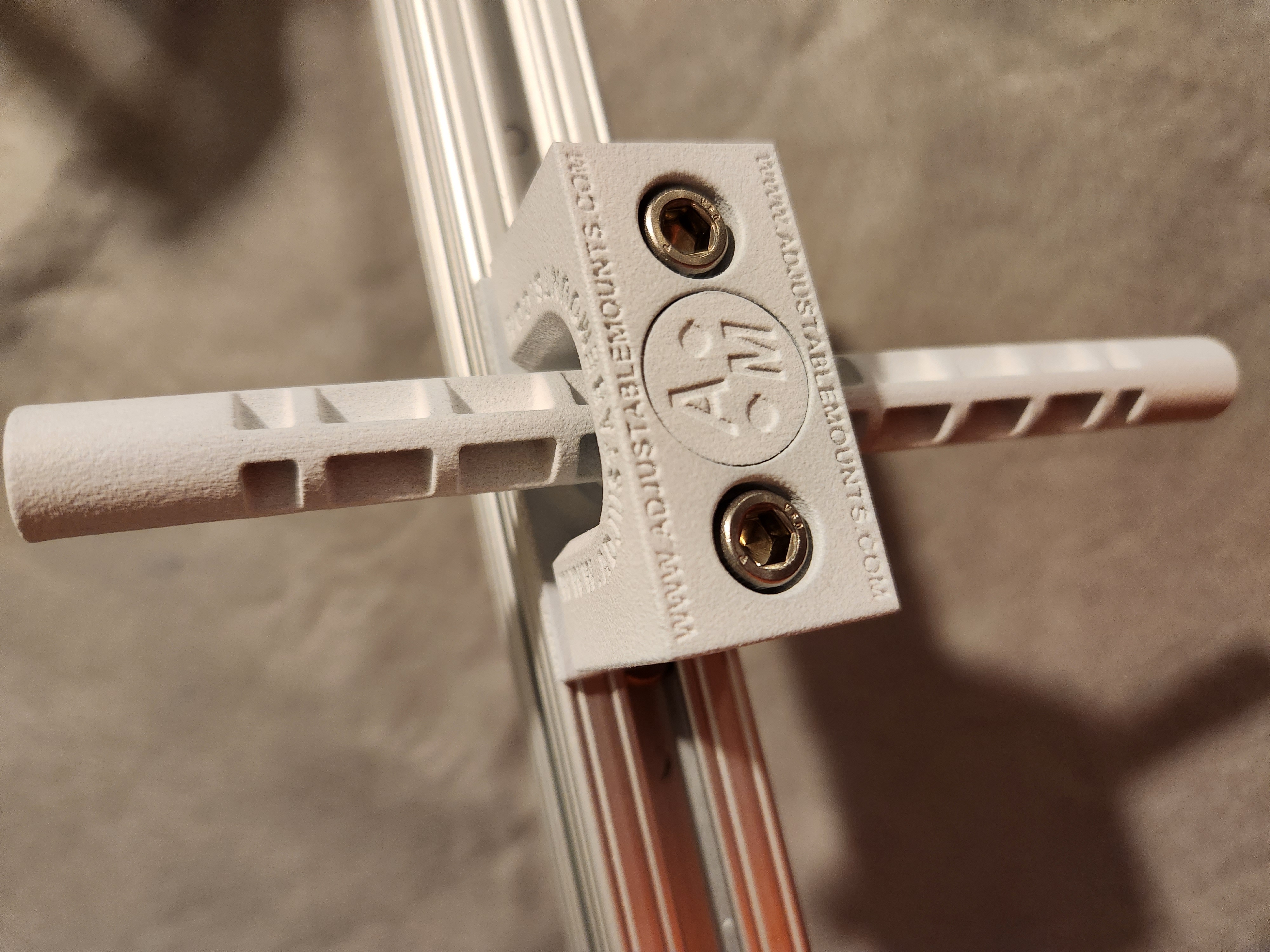 Swivel Assembly (T-Slot mounting bracket) clamped onto T-slot rail, close-up