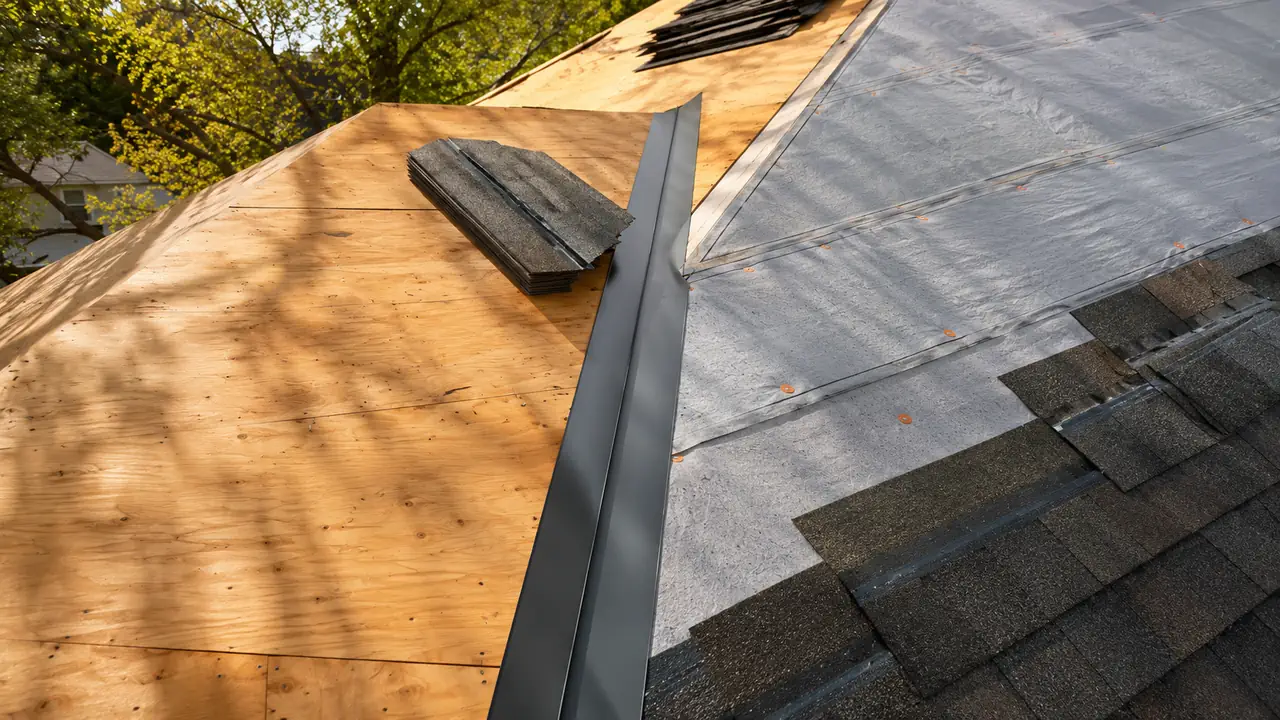 Roof replacement crew removing old shingles and installing new architectural shingles on Seattle home