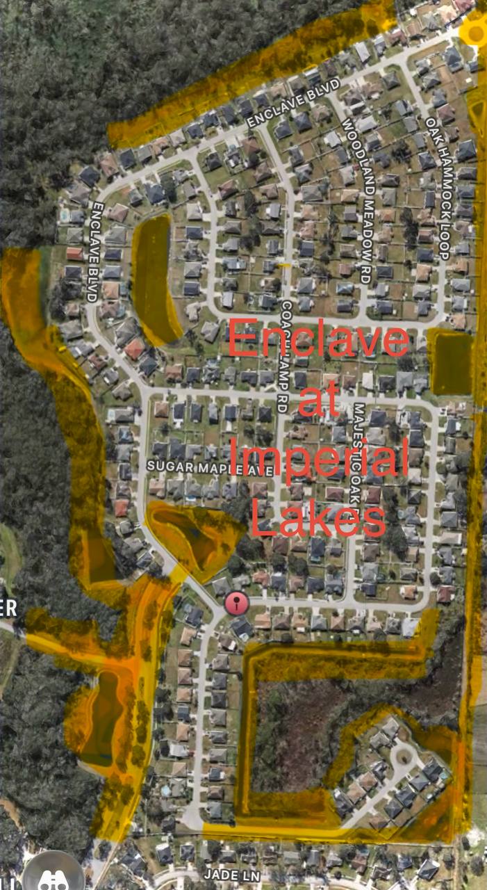 Aerial view of the Enclave at Imperial Lakes community in Mulberry, Florida, showing the boulevard and retention ponds maintained by Evergreen Lawns and Landscaping