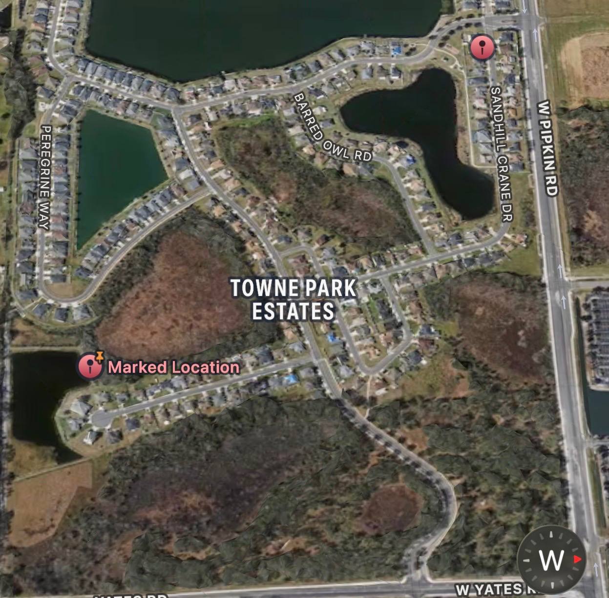 Aerial view of Towne Park Estates in Lakeland, Florida, showing community lakes and mowed common areas maintained by Evergreen Lawns and Landscaping