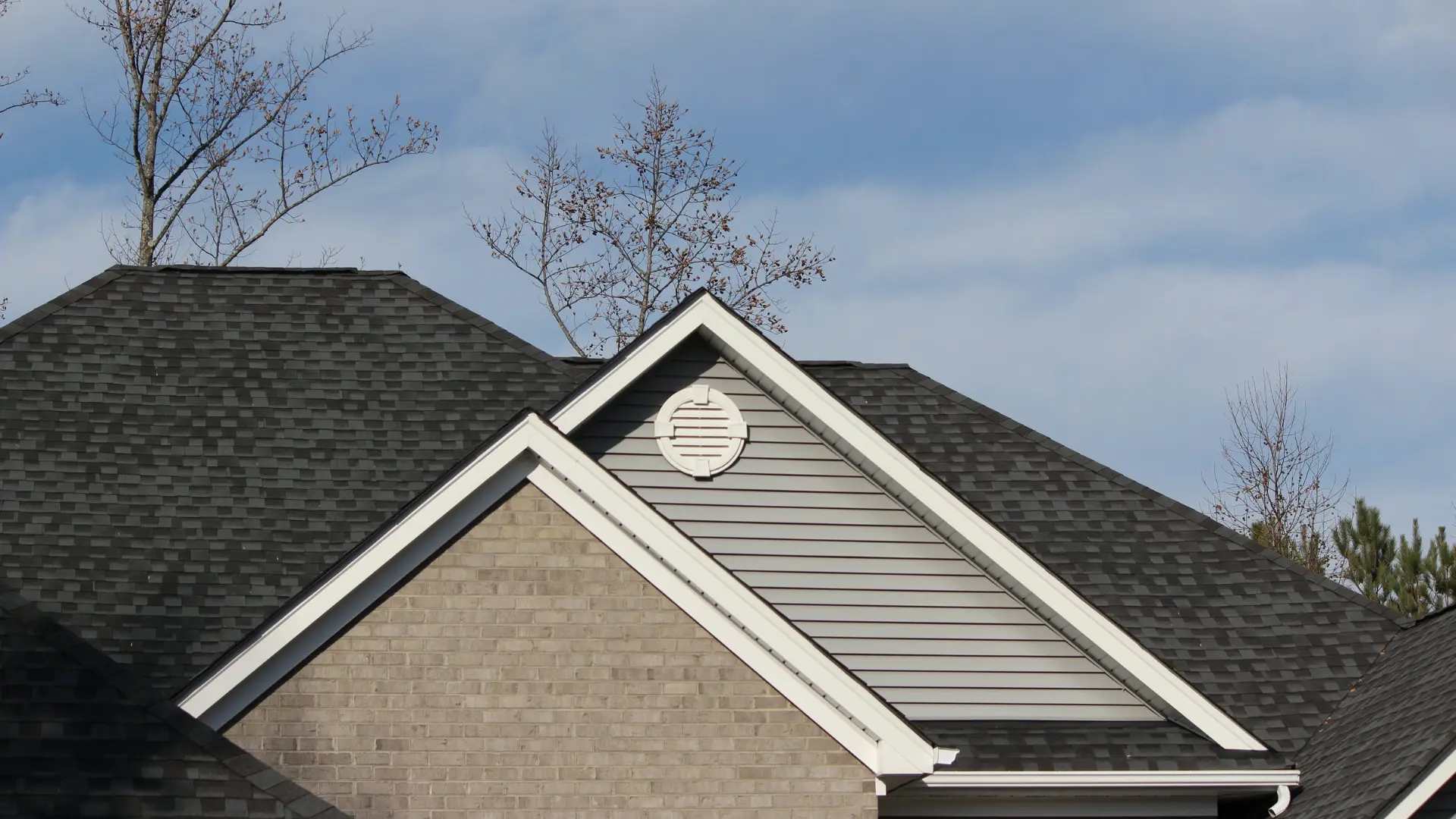 Neos Roofing crew performing a tear-off and re-roof in Warren, Ohio