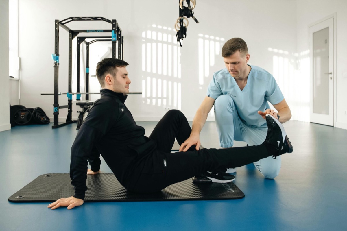 Physiotherapist guiding a patient through knee rehab