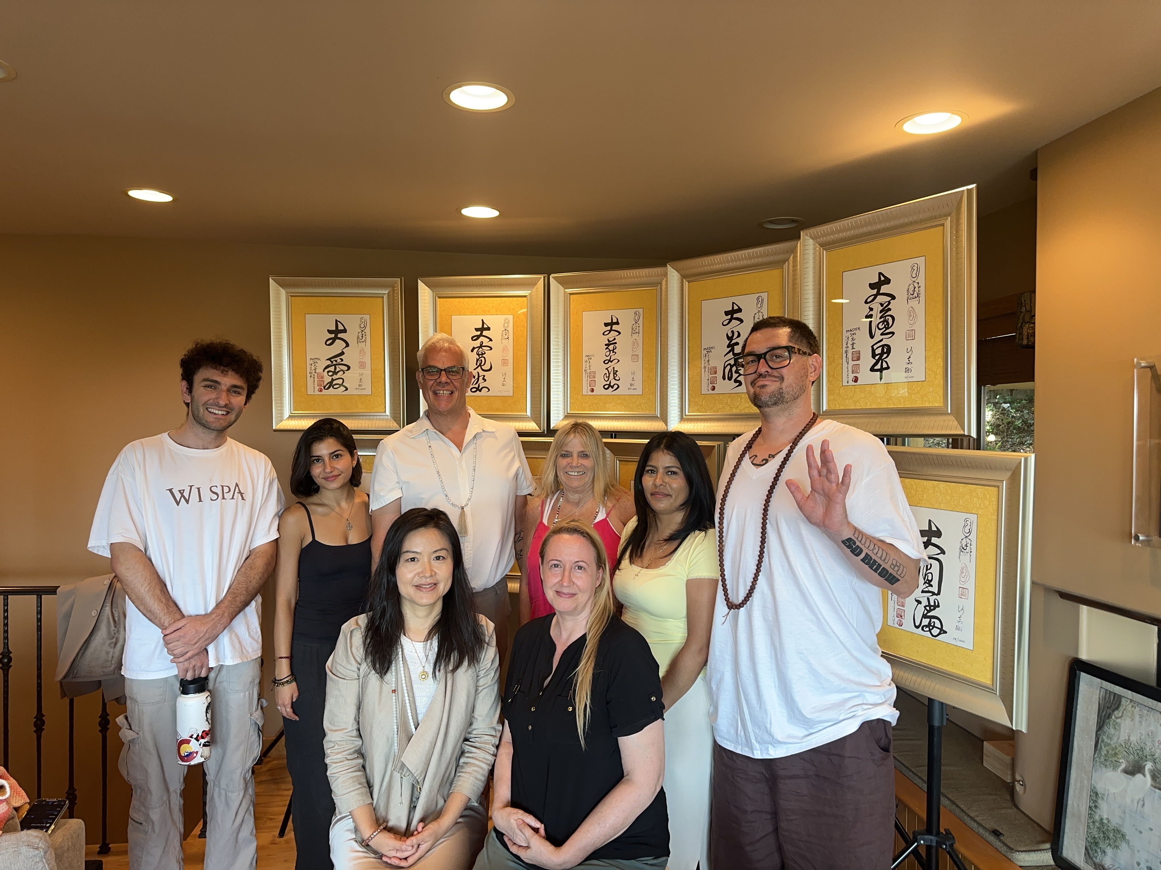 Heart Center LA group gathering with calligraphy artwork