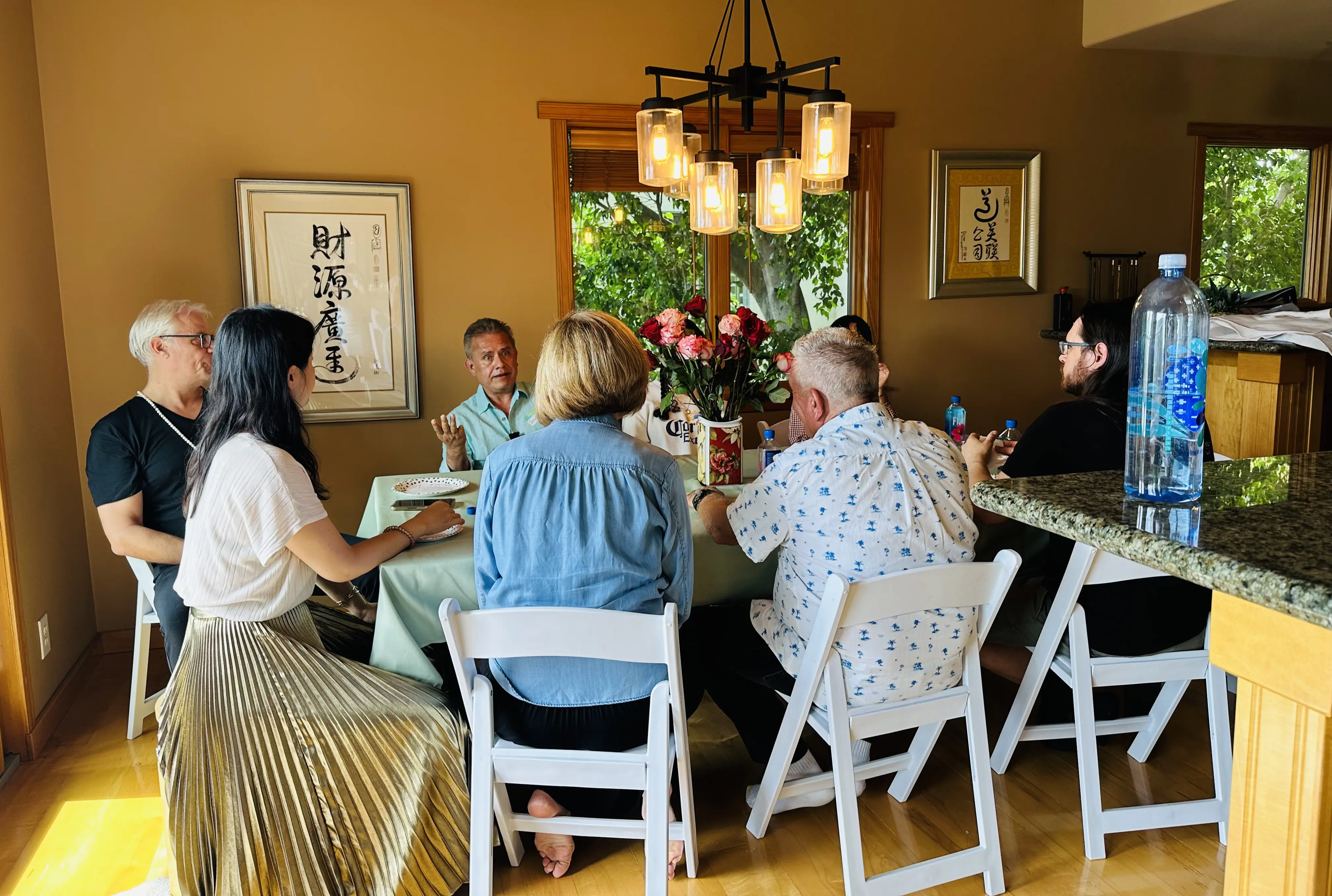 Small group conversation around a table