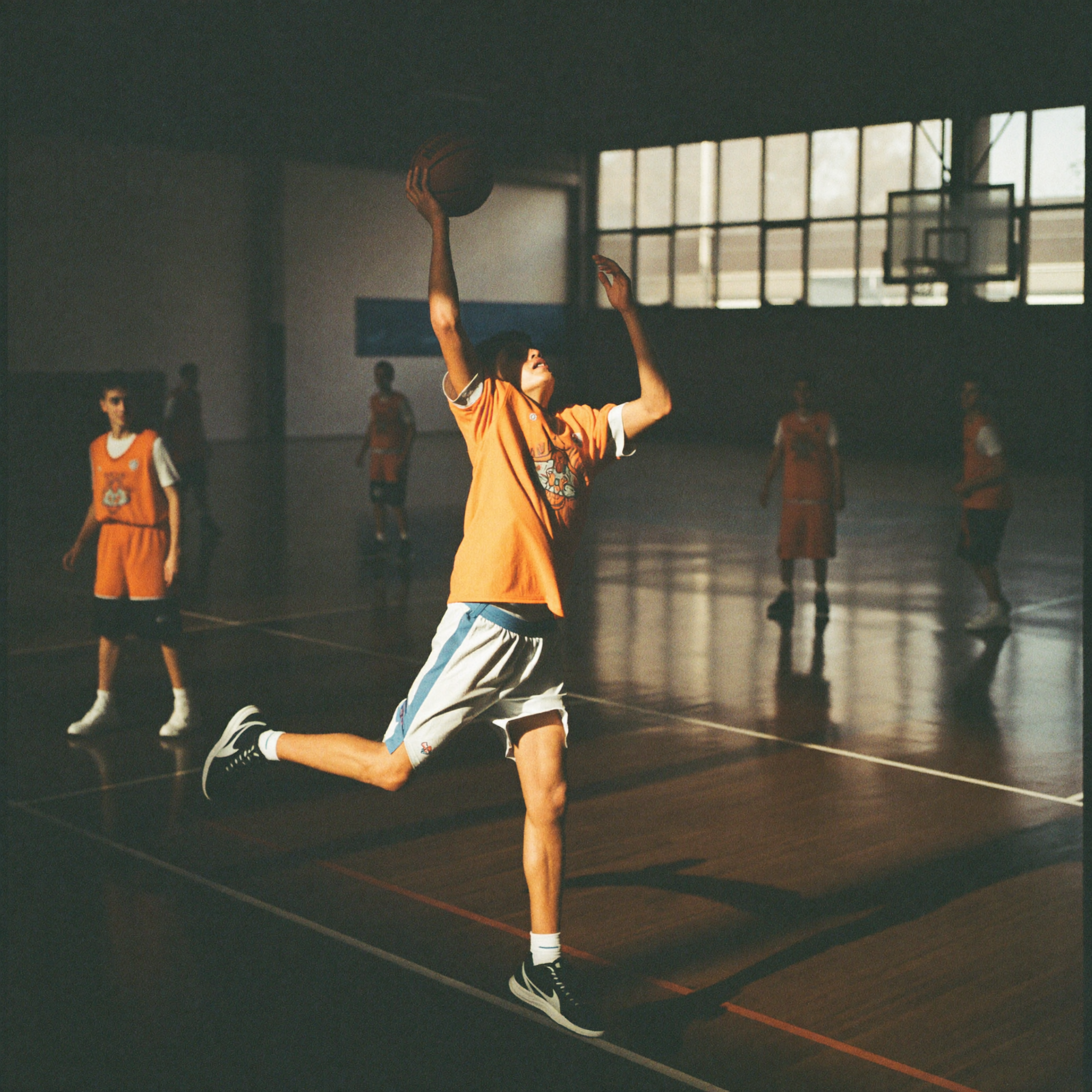 A pickup basketball game in the open gym