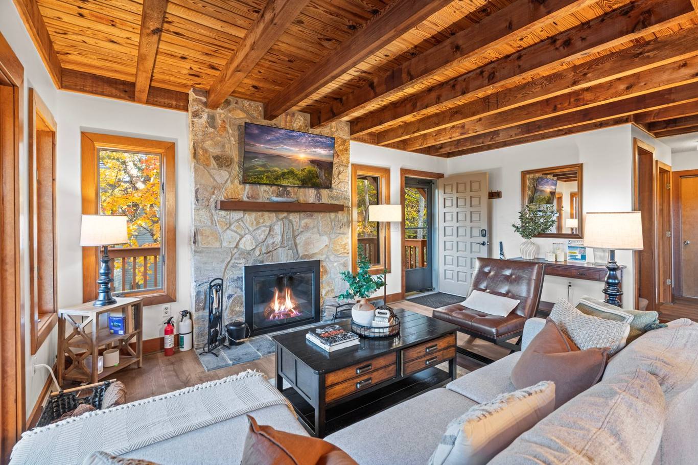 Living room with stone fireplace