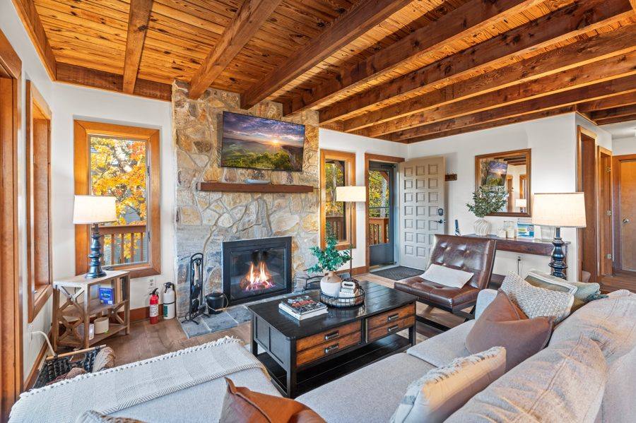 Living room with stone fireplace