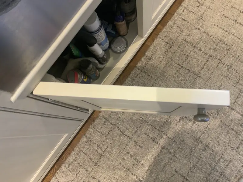 After photo of the same cabinet door with the gouges repaired and the finish matched.