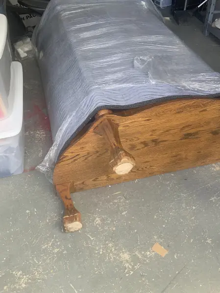 After photo of the same furniture frame with the corner leg rebuilt and shaped to match the original.