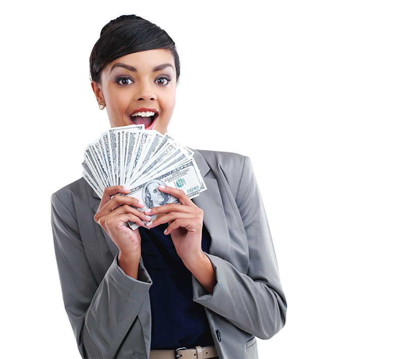 A woman in a business suit holding a fan of hundred-dollar bills