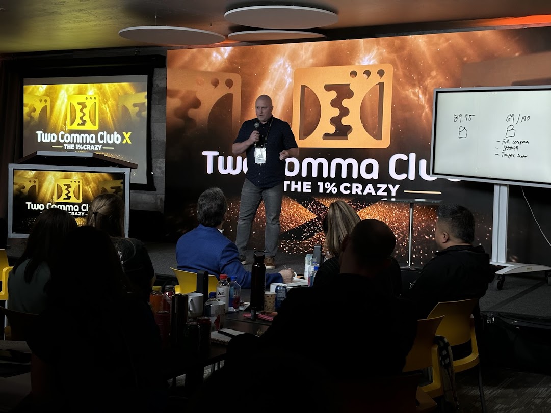 Jared Erni speaking on stage at Two Comma Club X
