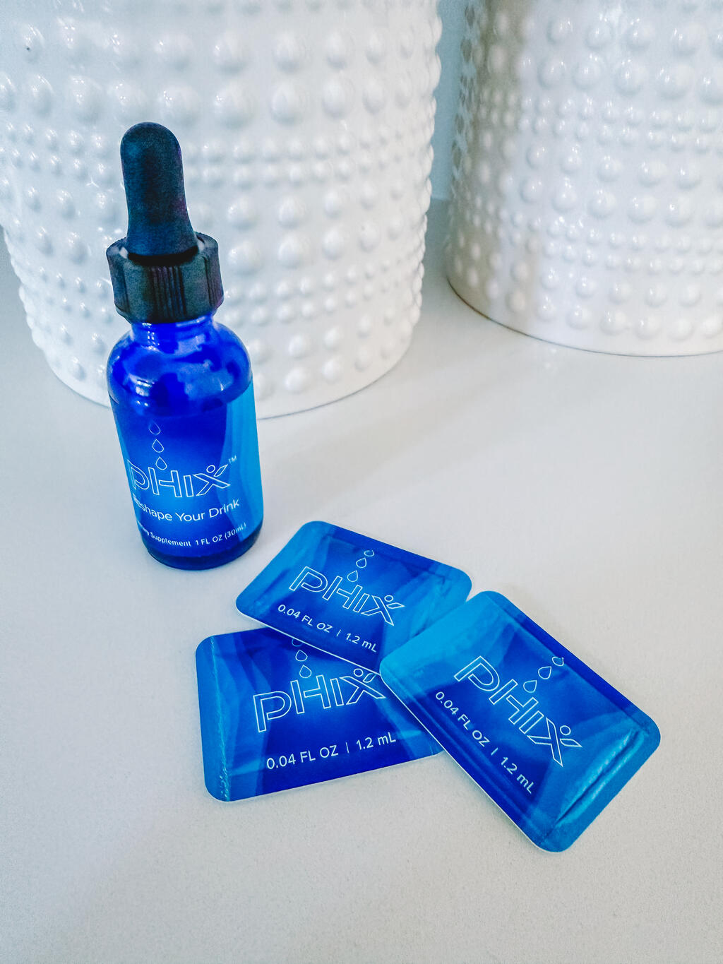 Blue PHIX Dropper Bottle and Single Packets