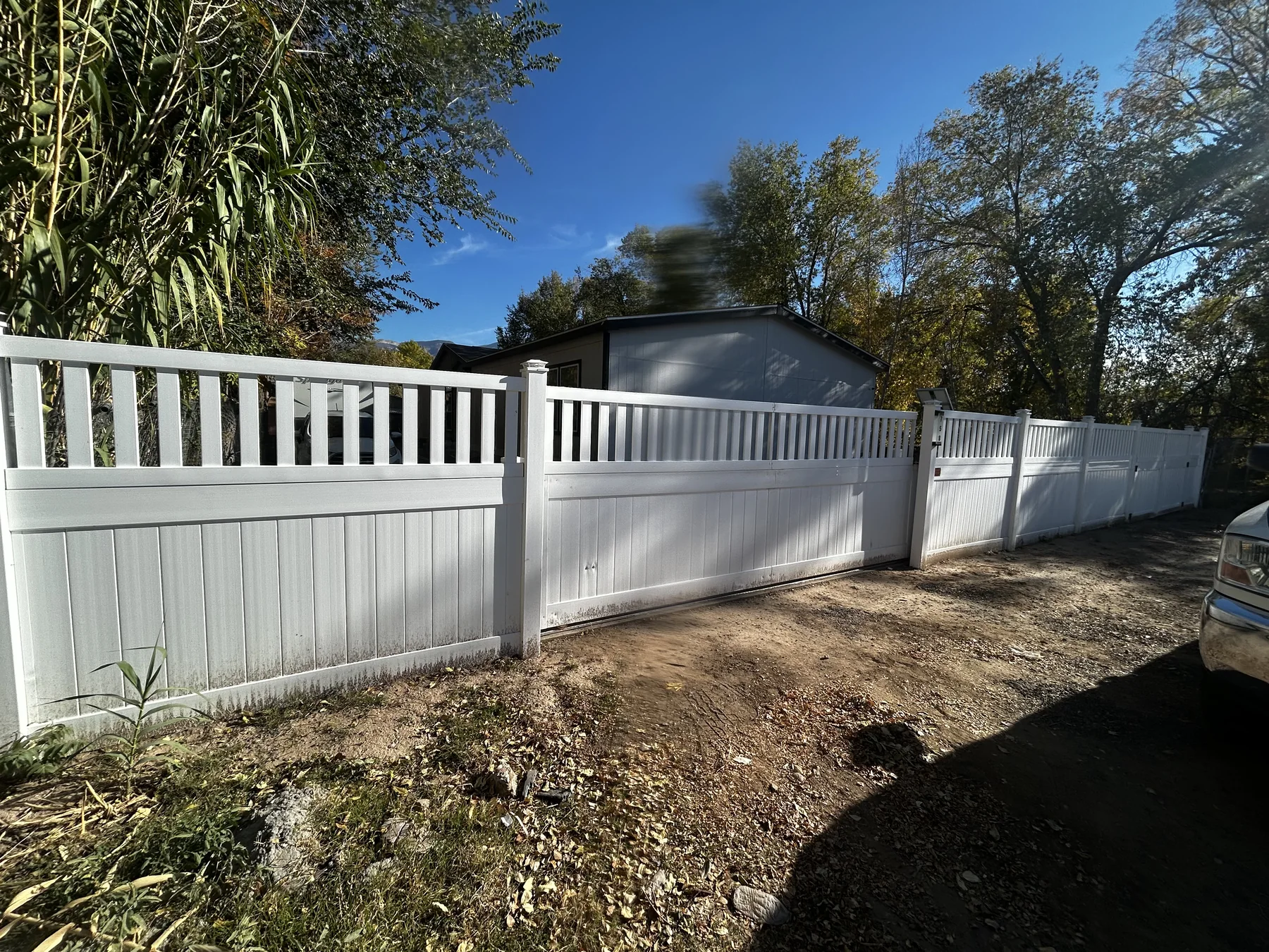 White privacy fence and wide gate
