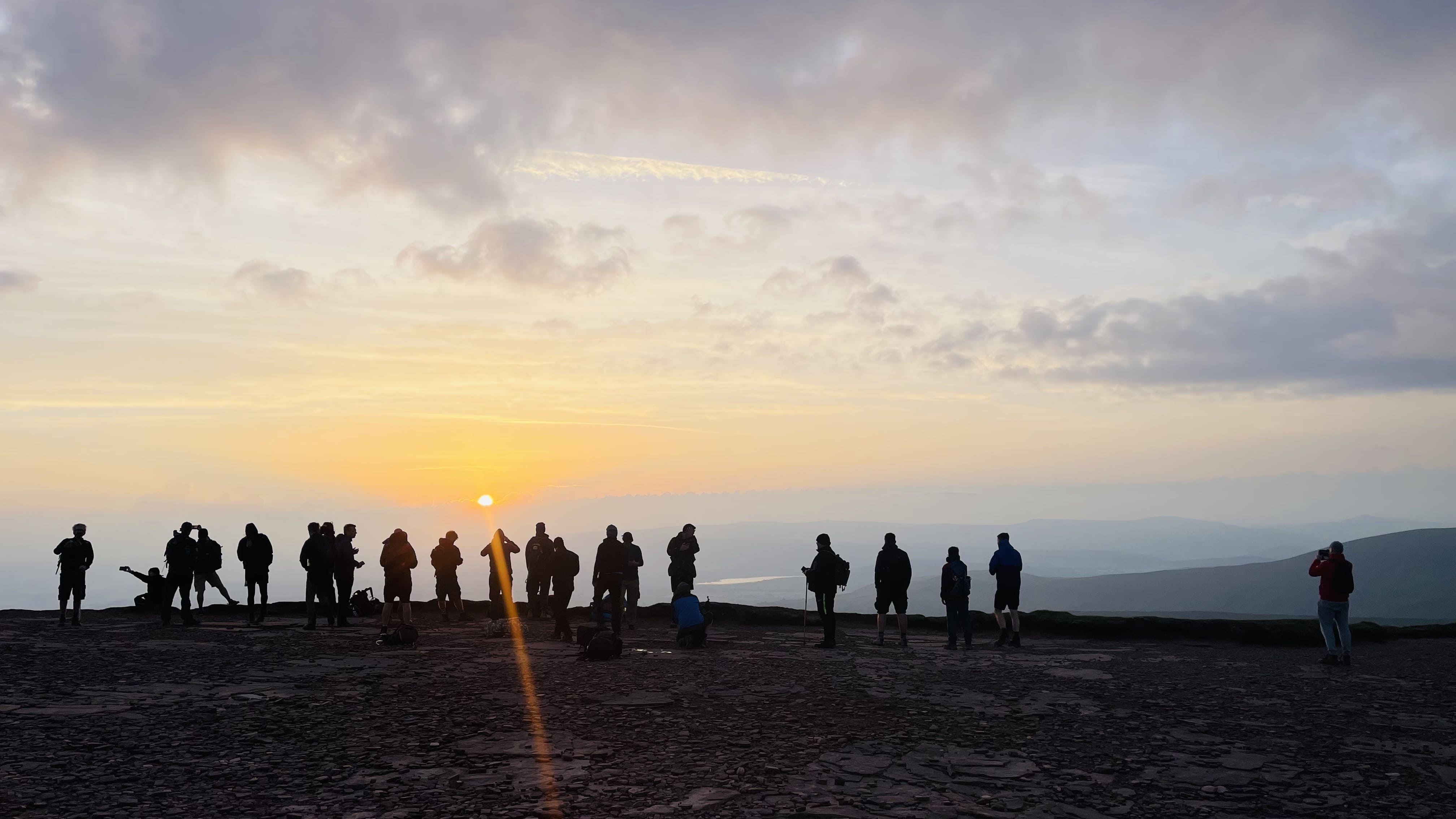 Top 1% Club members at sunrise during a group experience